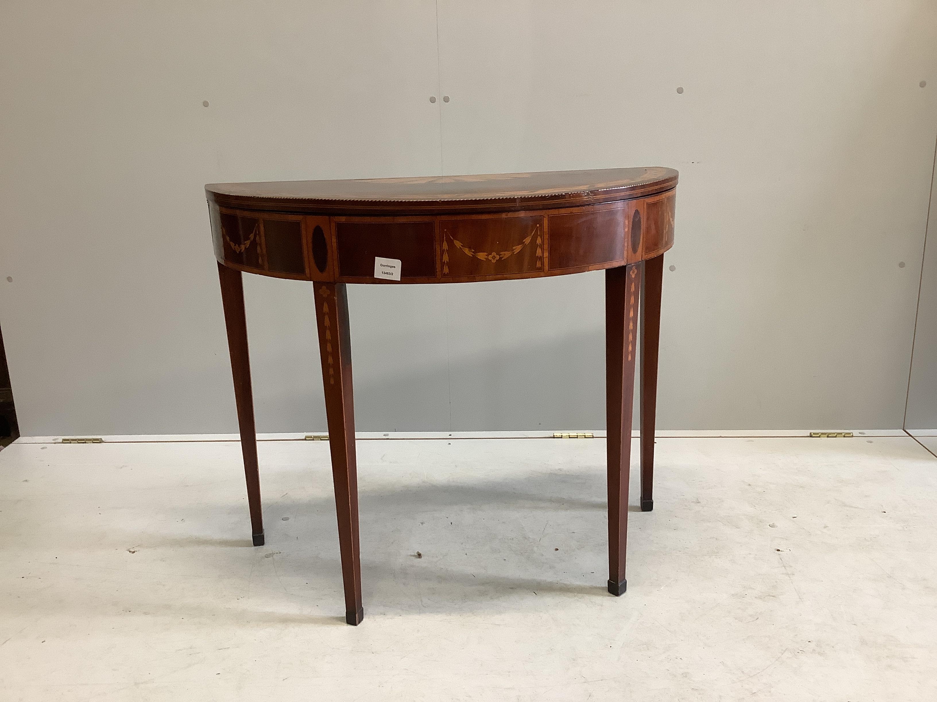 An Edwardian Sheraton Revival inlaid mahogany and marquetry D shaped card table, width 89cm, depth 44cm, height 75cm